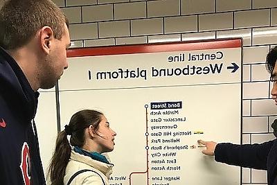 Students study a Tube map in London