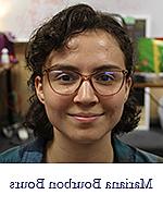 Headshot of Mariana Bourbon Bours, a woman with reddish frame glasses and brown hair cut above shoulder length